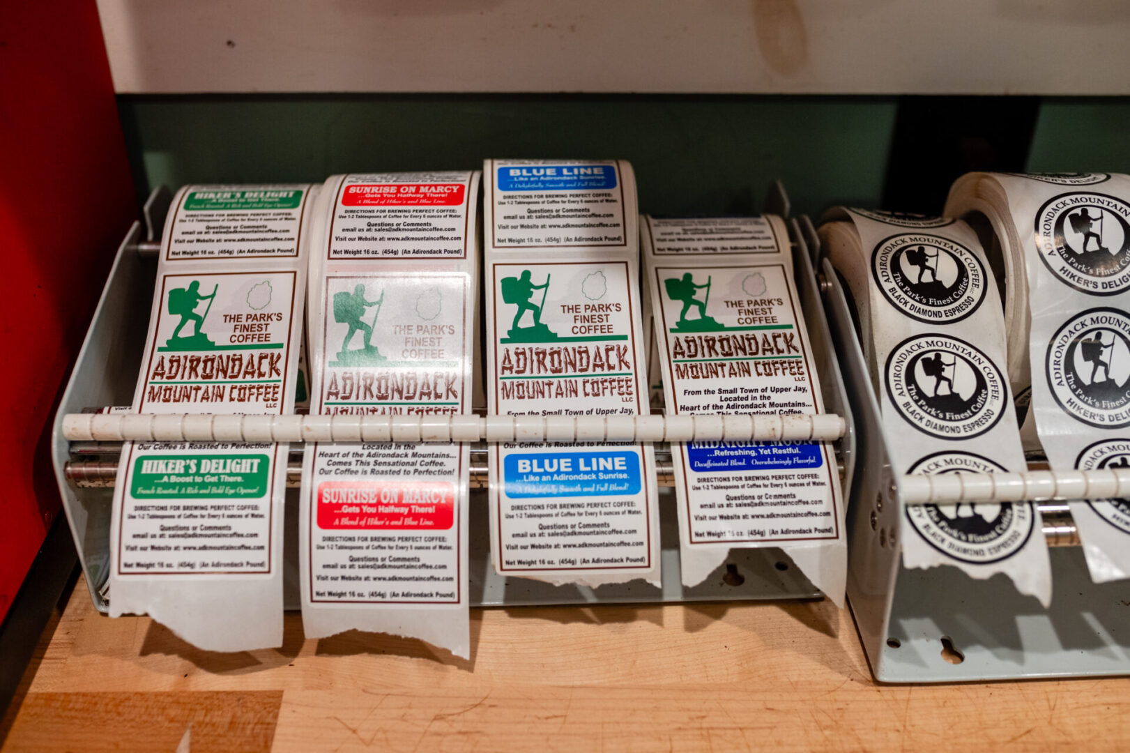 A shelf with many different types of cigarettes.