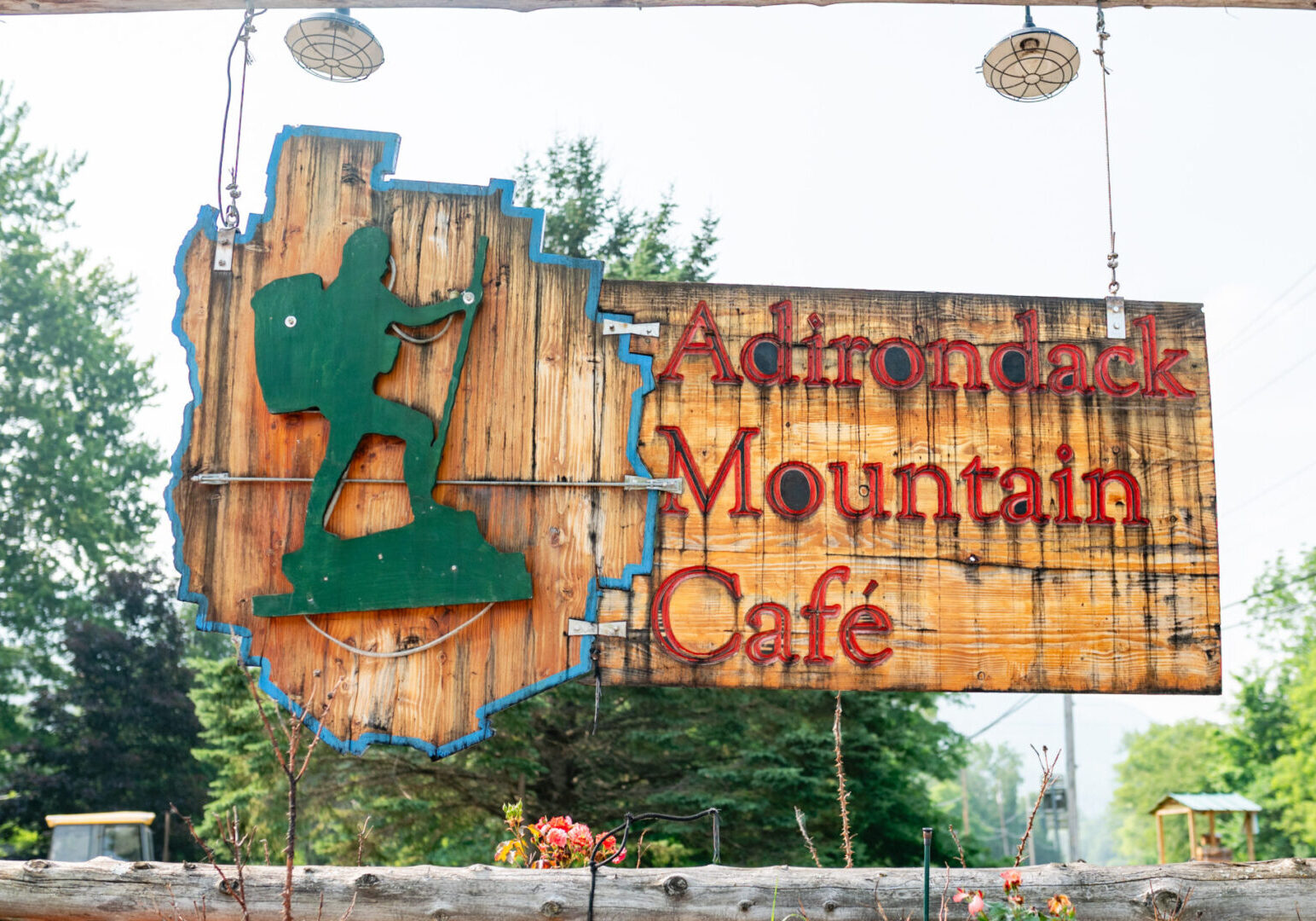 A sign for the mountain cafe in the mountains.