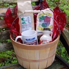 A basket of coffee, tea and other items.